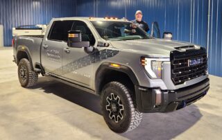 President Brad Shields stands with his truck.